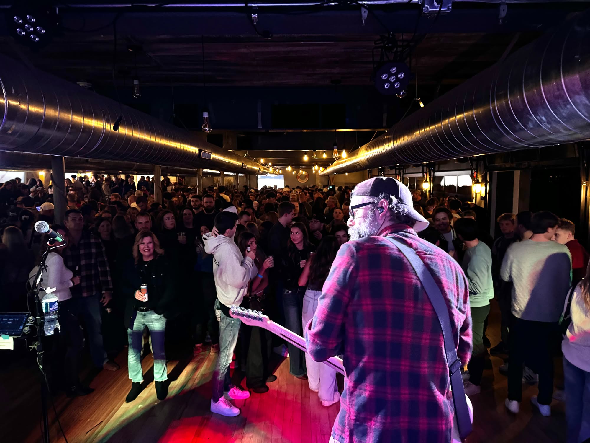 A view from the stage across a packed dance floor